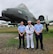 Airman 1st Class Wesley Davies (left), Hospital Corpsman First Class Corey Davies (middle) and Airman 1st Class Owen Davies (right) pose for a picture in front of a A-10 Thunderbolt II after graduating Air Force Basic Training. (Courtesy photo)