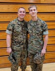 Airman 1st Class Wesley Davies (right) poses with his dad Hospital Corpsman First Class Corey Davies (left) during a Marine Corps Junior Reserve Officer Training Corps promotion ceremony. (Courtesy photo)