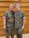 Airman 1st Class Wesley Davies (right) poses with his dad Hospital Corpsman First Class Corey Davies (left) during a Marine Corps Junior Reserve Officer Training Corps promotion ceremony. (Courtesy photo)