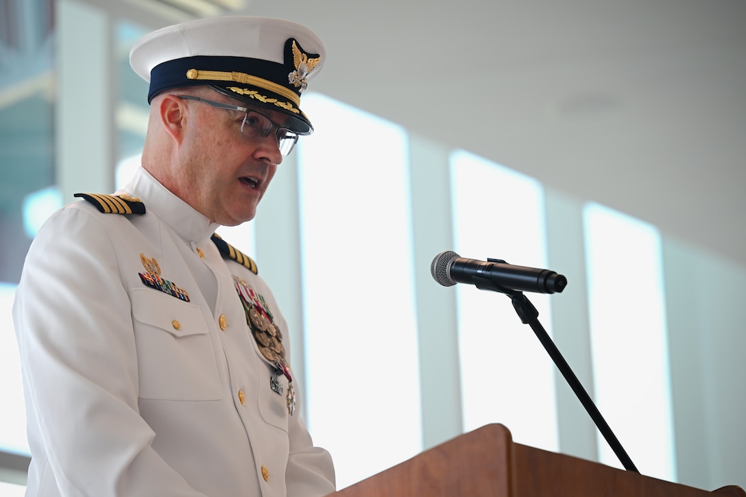 U.S. Coast Guard Capt. Chris Cederholm, the departing commander of U.S. Coast Guard Sector Miami, addressing the crowd during a change of command ceremony at the Port of Miami, April 24, 2025. Cederholm gave personal remarks about Capt. Frank Florio and his time serving as the commander. (U.S. Coast Guard photo by Petty Officer 3rd Class Jessica Walker)