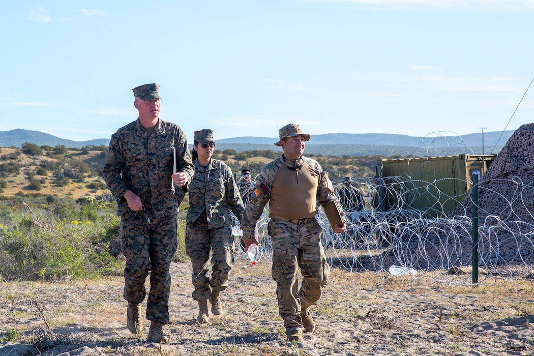 U.S. Marine Corps Col. Ryan Allen, commanding officer of Marine Air Control Group 48 and Chilean Marine Col. Francisco Cabezon Gonzalez, walk through Expeditionary Advanced Base North in Puerto Aldea, Chile on Sept. 6, 2024.  While walking they discussed the simulated amphibious raid practice happening the following day during Exercise UNITAS LXV. UNITAS, which is Latin for “unity”, was conceived in 1959 and has taken place annually since first conducted in 1960. This year marks the 65th iteration of the world’s longest running annual multinational maritime exercise. (U. S. Marine Corps photo by Lance Cpl. Payton Goodrich)