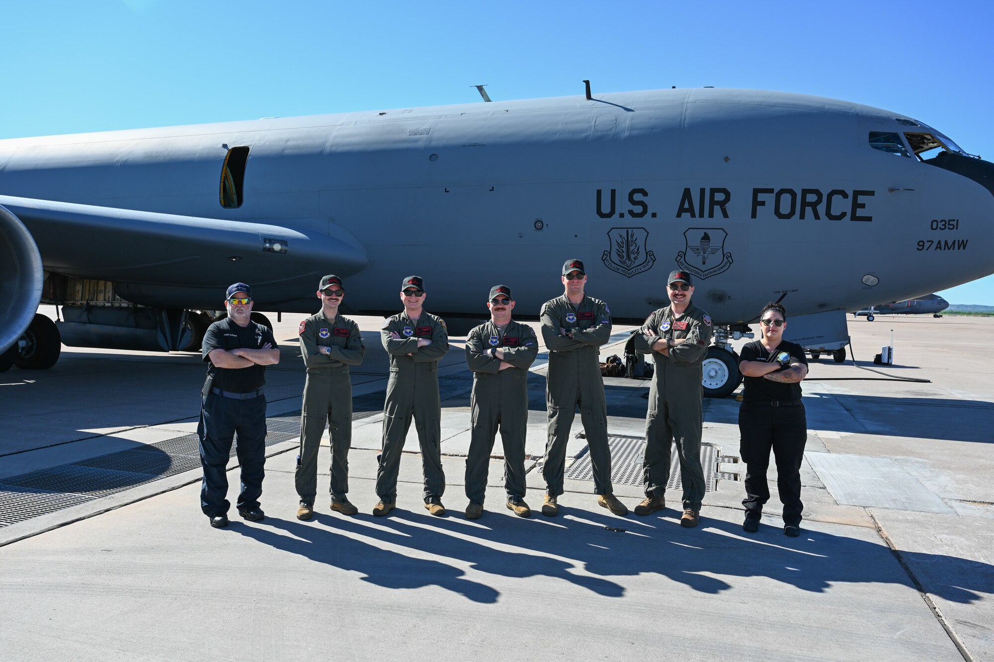 U.S. Air Force Airmen from the 54th Air Refueling Squadron and 97th Aircraft Maintenance Squadron pose for a photo in front of a KC-135 Stratotanker aircraft at Dyess Air Force Base, Texas, April 21, 2025. From left to right, the crew consists of Chad Clement, hydraulics specialist, Staff Sgt. Nick Belmonte, boom operator, Capt. Peter Kuzniewski, pilot, Capt. Jacob Cable, pilot, Capt. Connor Brown, pilot, Staff Sgt. Gage Fontenot, boom operator, and Julianne Martinez, crew chief. (U.S. Air Force photo by Airman 1st Class Jonah Bliss)