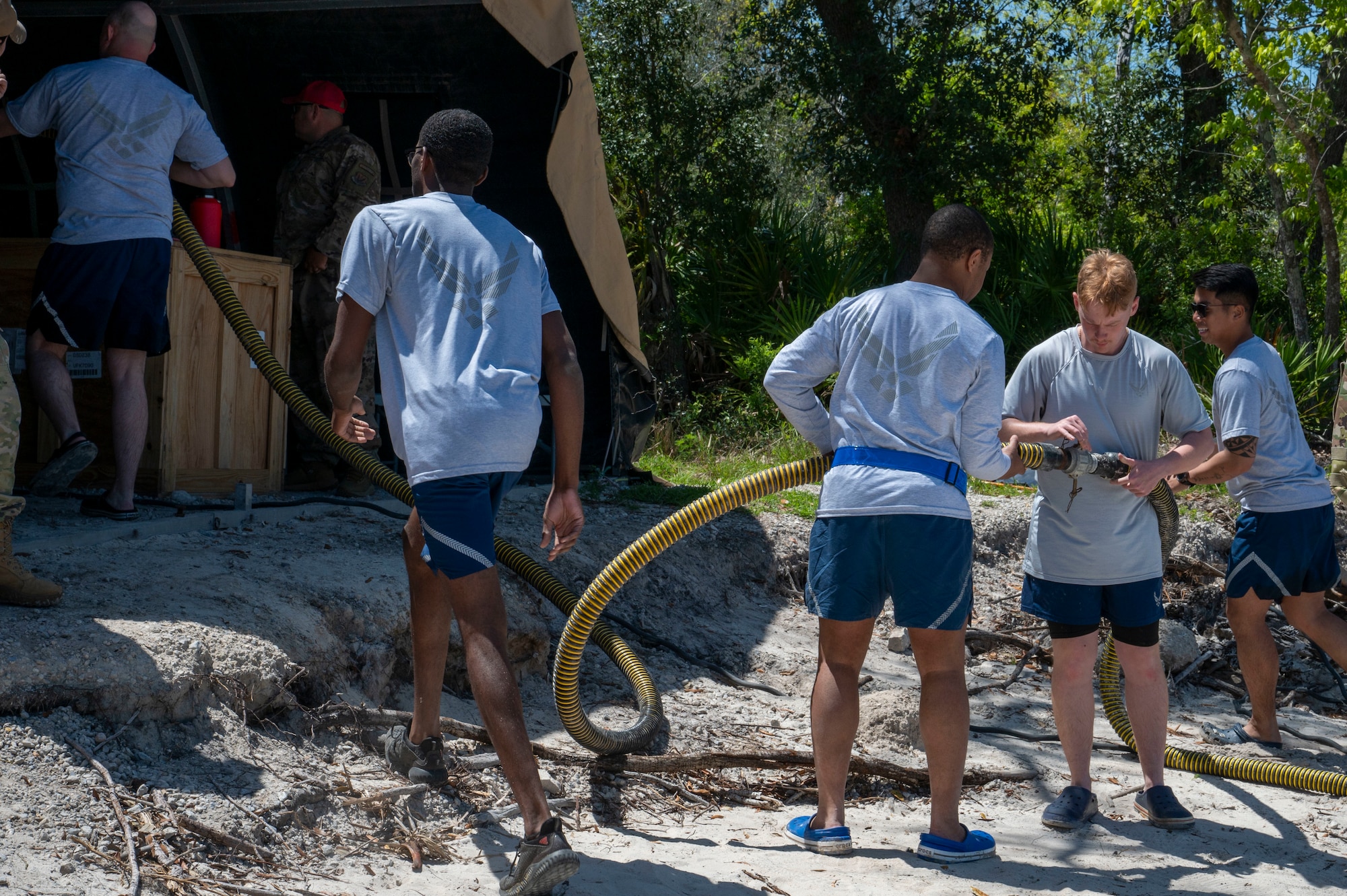 U.S. Air Force Airmen assigned to the 22nd Air Task Force, utilize an ocean intake structure system during a Silver Flag exercise at Tyndall Air Force Base, Florida, April 9, 2025. This is an intake system designed to transform sea water into drinkable water. The 22nd Air Task Force is designed to have its Airmen assigned to train through complex scenarios together throughout the AFFORGEN cycle, increasing combat capability and unit cohesion. (U.S. photo by Airman 1st Class Samantha Thorn)