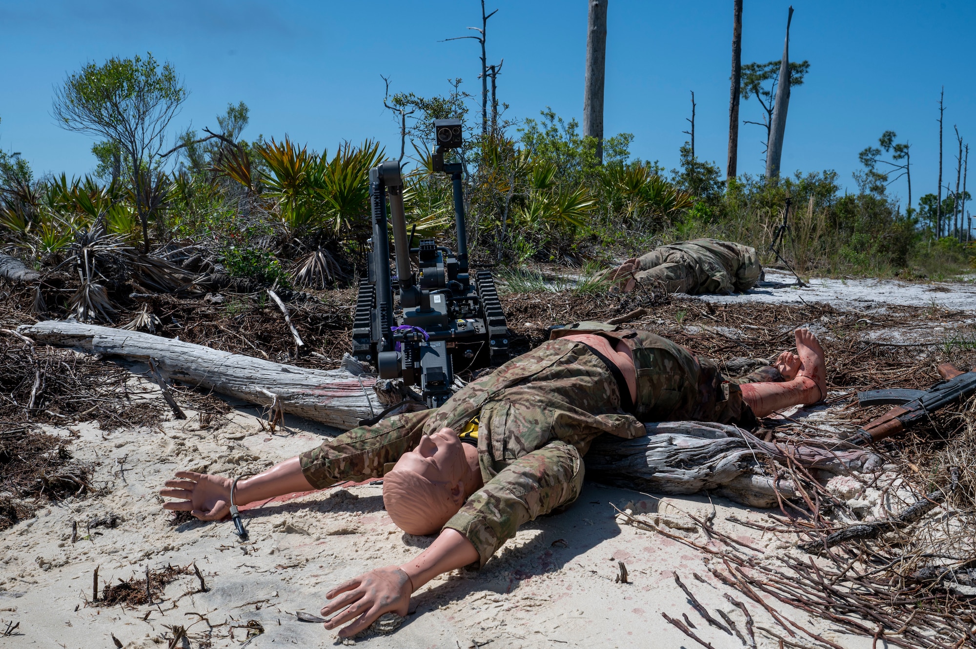 The Man Transportable Robot System Increment II advances towards a simulated hazard during a Silver Flag exercise at Tyndall Air Force Base, Florida, April 9, 2025. The MTRS II is a remotely operated, medium-sized robotic system that enables Explosive Ordnance Disposal units to detect, confirm, identify and dispose of unexploded explosive ordnance and other hazards from a safe distance. Exercises like this will continue to propel the 22nd ATF to operate effectively under stressful conditions in contested environments, resulting in a diverse force of Airmen prepared to undertake mission requirements. (U.S. photo by Airman 1st Class Samantha Thorn)