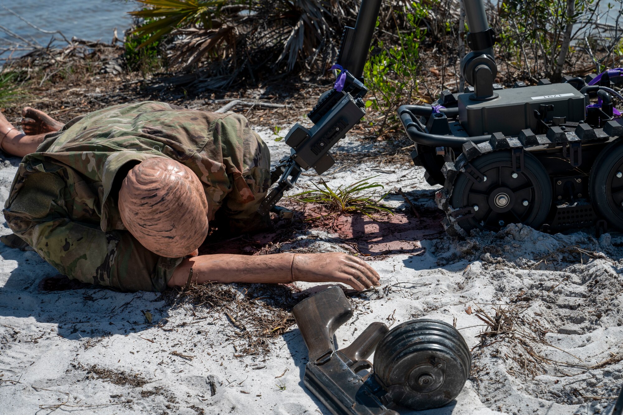 The Man Transportable Robot System Increment II advances towards a simulated hazard during a Silver Flag exercise at Tyndall Air Force Base, Florida, April 9, 2025. The MTRS II is a remotely operated, medium-sized robotic system that enables Explosive Ordnance Disposal units to detect, confirm, identify and dispose of unexploded explosive ordnance and other hazards from a safe distance. Exercises like this will continue to propel the 22nd ATF to operate effectively under stressful conditions in contested environments, resulting in a diverse force of Airmen prepared to undertake mission requirements. (U.S. photo by Airman 1st Class Samantha Thorn)