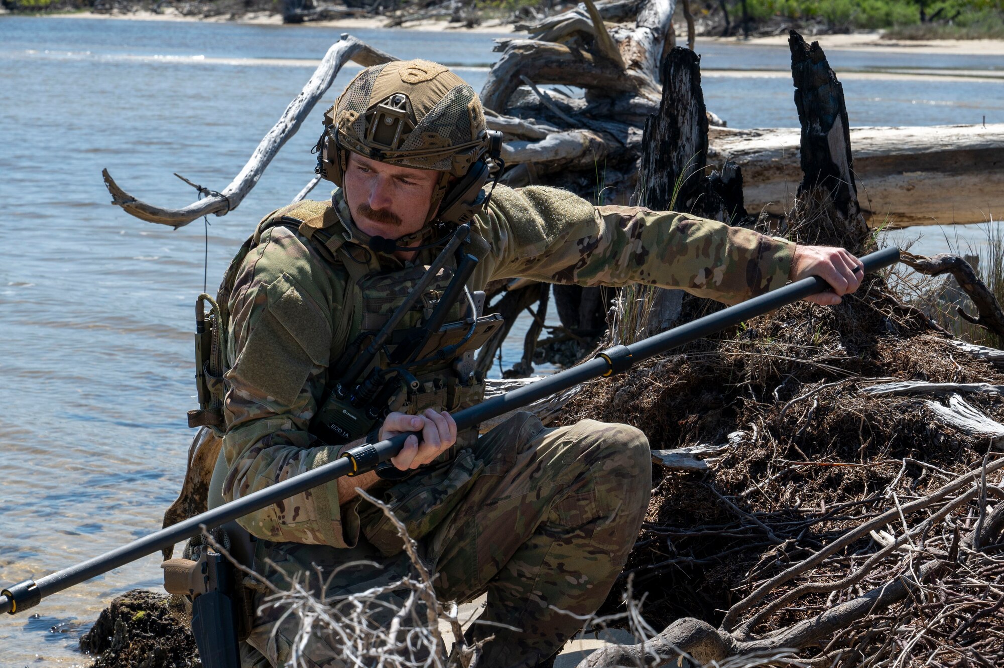 U.S. Air Force Tech. Sgt. Joel Miller, Explosive Ordnance Disposal team leader assigned to the 22nd Air Task Force, identifies an improvised explosive device during a Silver Flag exercise at Tyndall Air Force Base, Florida, April 9, 2025. EOD specialists are responsible for the safe handling and disposal of hazardous explosive materials. Exercises like this will continue to propel the 22nd ATF to operate effectively under stressful conditions in contested environments, resulting in a diverse force of Airmen prepared to undertake mission requirements. (U.S. photo by Airman 1st Class Samantha Thorn)