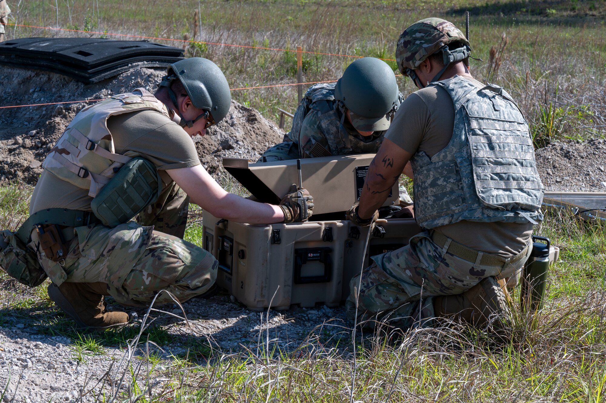 U.S. Air Force Airmen, assigned to the 22nd Air Task Force, set up approach lights for aircraft during a Silver Flag exercise at Tyndall Air Force Base, Florida, April 9, 2025. Approach lights provide visual guidance for aircraft to ensure safe landing procedures. This exercise was designed to evaluate and enhance the operational skills of the 22nd ATF, ensuring that they are an agile and responsive asset within our Air Force. (U.S. photo by Airman 1st Class Samantha Thorn)