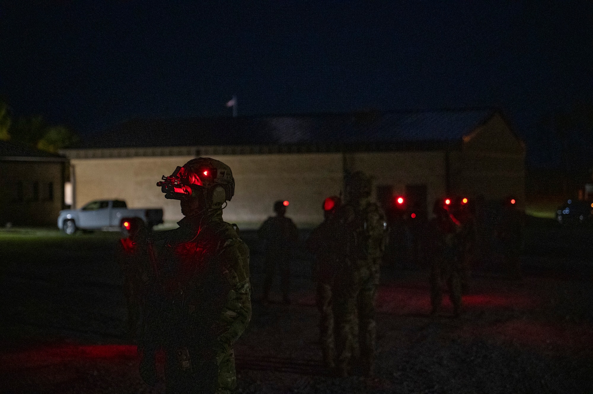 U.S. Air Force Airmen assigned to the 22nd Air Task Force, utilize night vision goggles while conducting a simulated nighttime reconnaissance operation during a Silver Flag exercise at Tyndall Air Force Base, Florida, April 10, 2025. Night vision enhances vision in low light settings, enabling missions to continue during any time of day. This exercise was designed to evaluate and enhance the operational skills of the 22nd ATF, ensuring that they are an agile and responsive asset within our Air Force. (U.S. photo by Airman 1st Class Samantha Thorn)