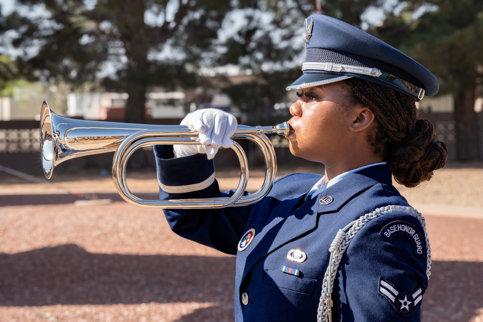 A base honor guardsman plays Taps during the Operation Eagle Claw ceremony at Cannon Air Force Base, New Mexico
