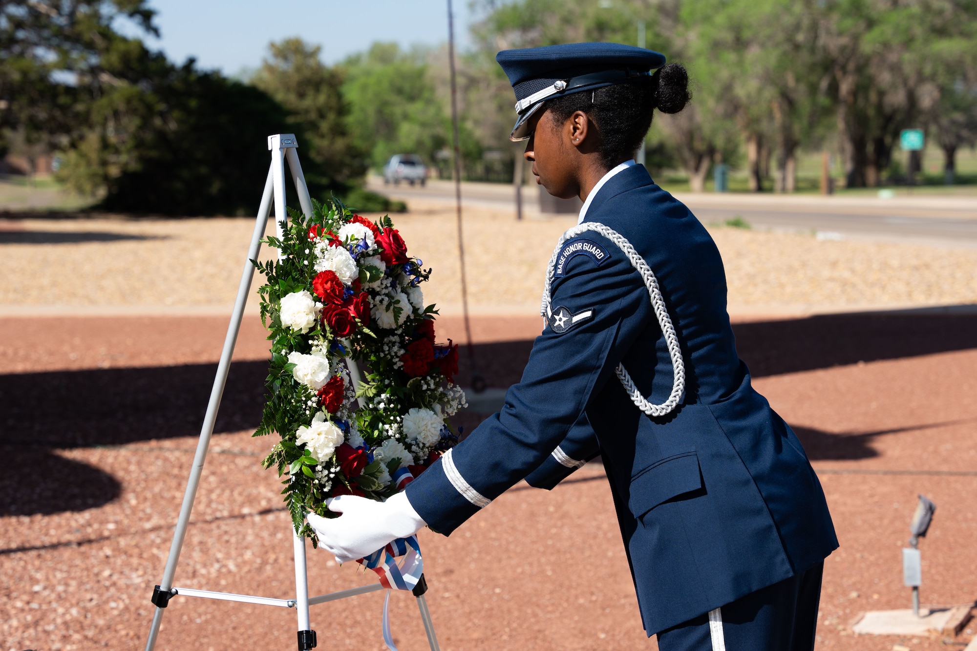 A base honor guardsman assigned to the 27th Special Operations Wing lays a wreath for the fallen service members of Operation Eagle Claw during a memorial at Cannon Air Force Base