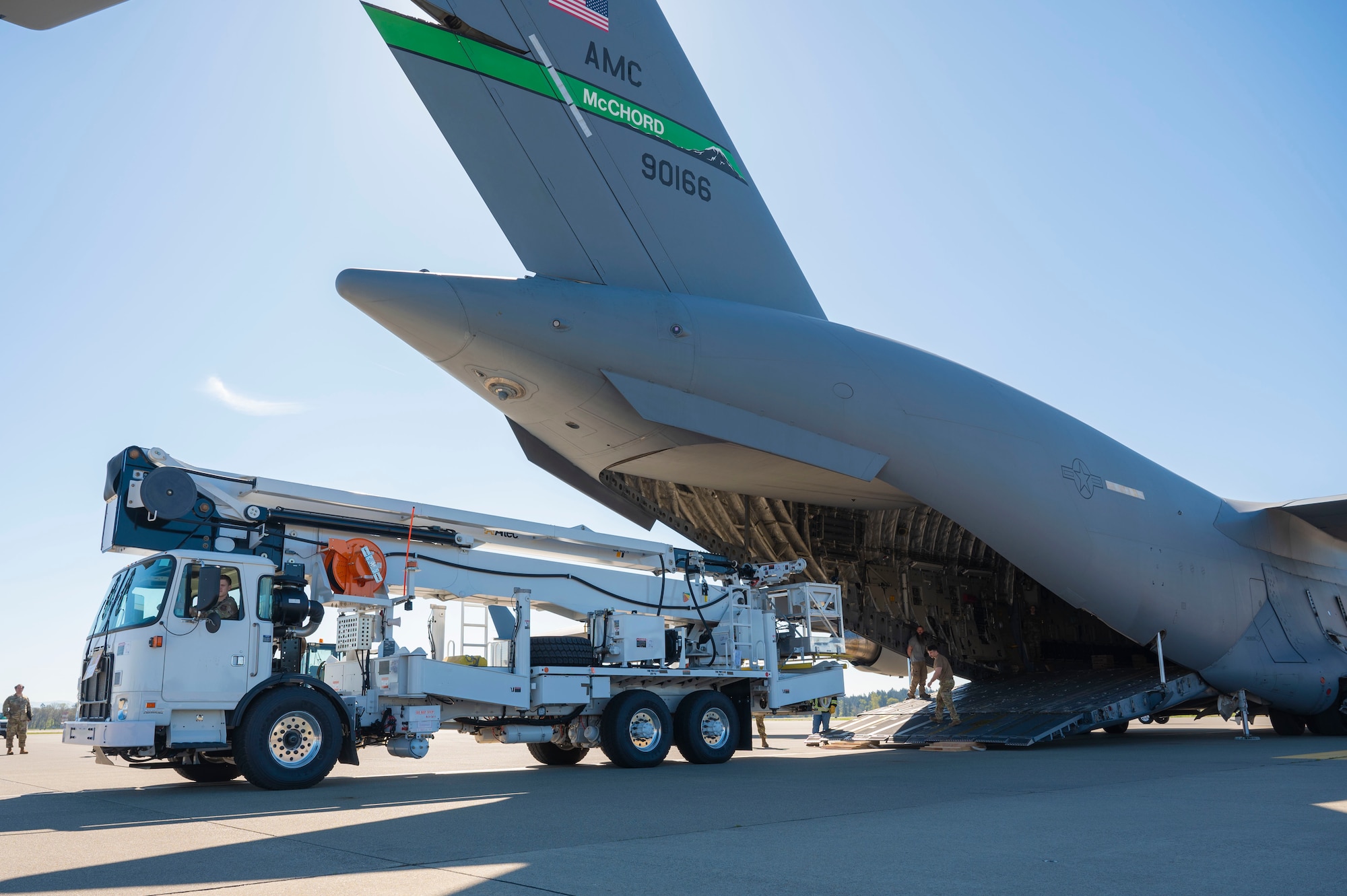 Team McChord Airmen and civilians across 62d Aerial Port Squadron, 62d Maintenance Group and the 4th Airlift Squadron loaded an Altec high-reach crane onto a C-17 Globemaster III at Joint Base Lewis-McChord, Washington, April 17, 2025. The crane was transported to Arizona to facilitate the replacement of the pitch trim actuator in the tail of another 62d Airlift Wing C-17. This crucial transport ensures Team McChord Airmen and aircraft are returned to a mission-capable status to support today’s global airlift mission.