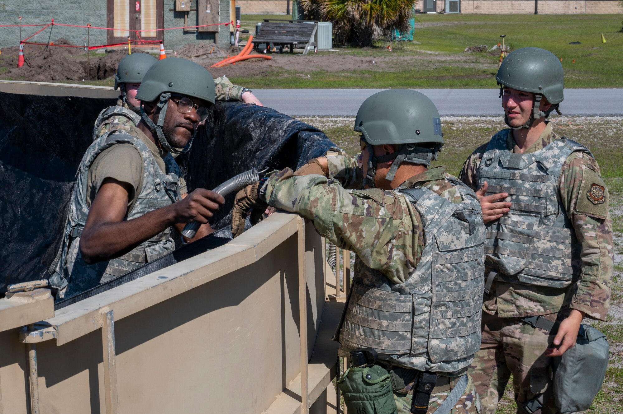 U.S. Air Force Airmen assigned to the 22nd Air Task Force, build a waste tank during a Silver Flag exercise at Tyndall Air Force Base, Florida, April 10, 2025. The 22nd ATF participated in rigorous exercises and diverse training programs to ensure that ATFs are fully prepared to execute assigned missions. (U.S. photo by Airman 1st Class Samantha Thorn)