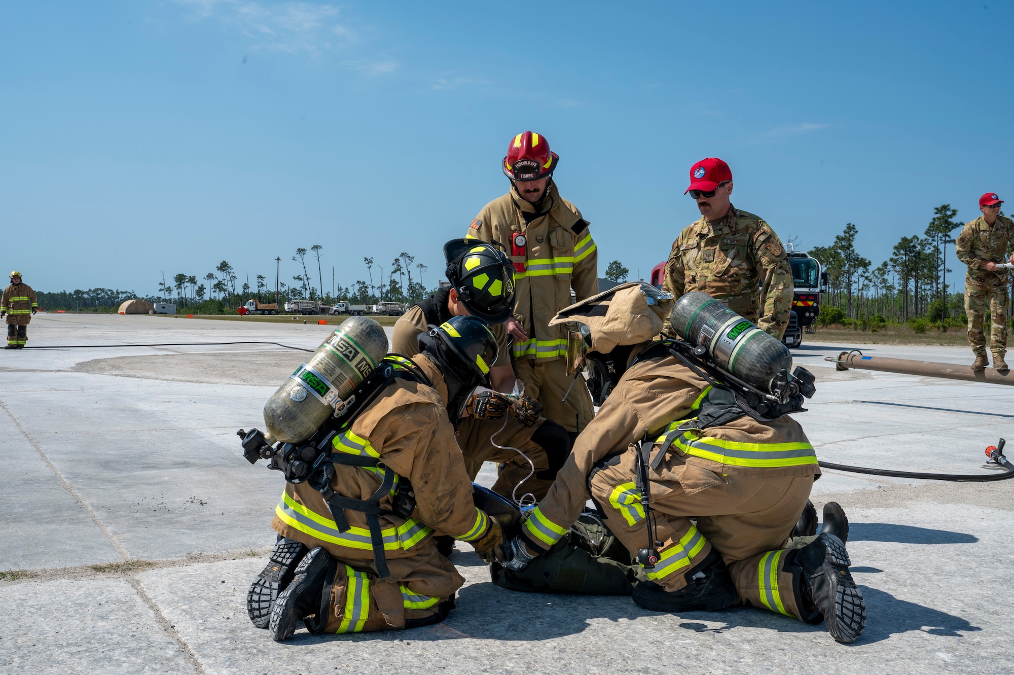 U.S. Air Force fire protection specialists assigned to the 22nd Air Task Force, respond to a simulated emergency during a Silver Flag exercise at Tyndall Air Force Base, Florida, April 11, 2025. This exercise was designed to evaluate and enhance the operational skills of the 22nd ATF, ensuring that they are an agile and responsive asset within our Air Force. (U.S. photo by Airman 1st Class Samantha Thorn)