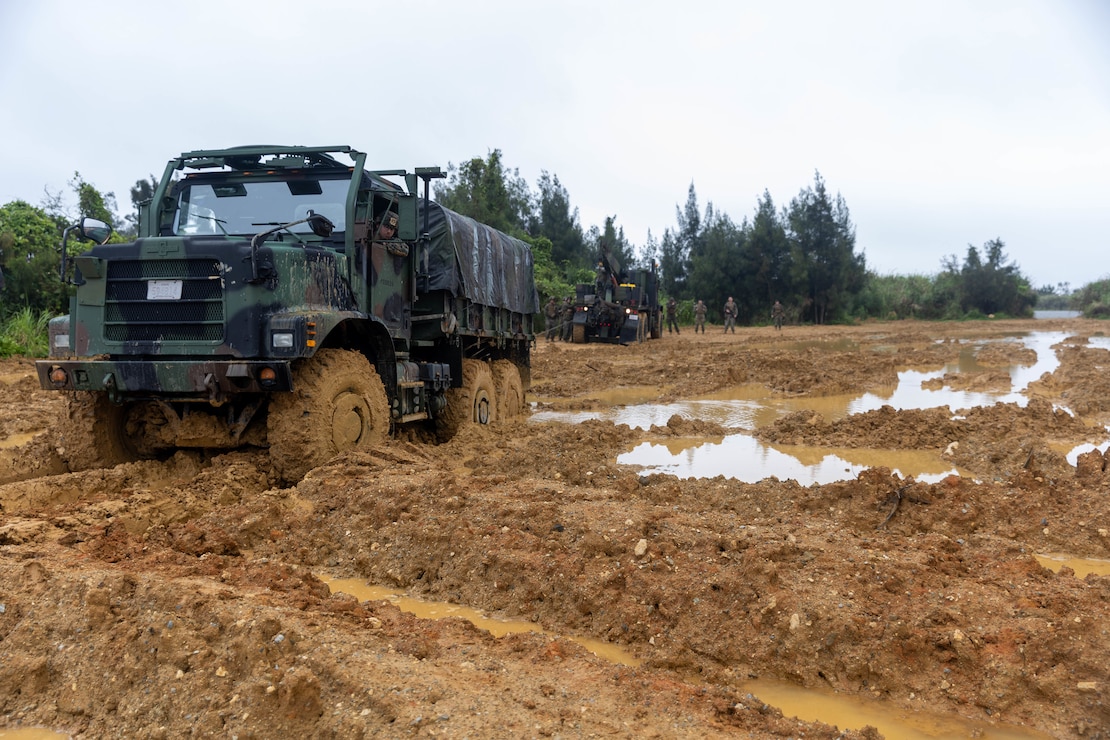 A U.S. Marine Corps MK36 wrecker with Marine Air Support Squadron 2, Marine Air Control Group 18, 1st Marine Aircraft Wing pulls a Medium Tactical Vehicle Replacement on Camp Hansen, Okinawa, Japan, April 23, 2025.