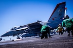 An F/A-18E Super Hornet from the “Mighty Shrikes” of Strike Fighter Squadron (VFA) 94 launches from the flight deck of the aircraft carrier USS Nimitz (CVN 68) in the Philippine Sea, April 23, 2025. Nimitz is underway in the U.S. 7th Fleet area of operations on a scheduled deployment, demonstrating the U.S. Navy's unwavering commitment to a free and open Indo-Pacific. (U.S. Navy photo by Mass Communication Specialist 2nd Class Hannah Kantner)