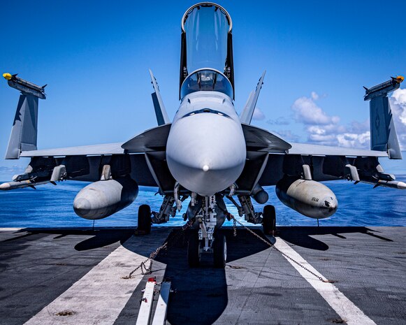 An F/A-18E Super Hornet from the “Mighty Shrikes” of Strike Fighter Squadron (VFA) 94 lprepares for flight operations on the flight deck of the aircraft carrier USS Nimitz (CVN 68) in the Philippine Sea, April 23, 2025. Nimitz is underway in the U.S. 7th Fleet area of operations on a scheduled deployment, demonstrating the U.S. Navy's unwavering commitment to a free and open Indo-Pacific. (U.S. Navy photo by Mass Communication Specialist 2nd Class Hannah Kantner)