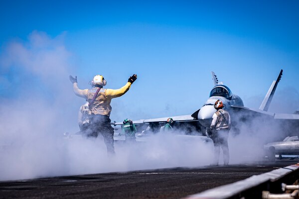 Sailors direct an F/A-18E Super Hornet from the “Mighty Shrikes” of Strike Fighter Squadron (VFA) 94 launches from the flight deck of the aircraft carrier USS Nimitz (CVN 68) in the Philippine Sea, April 23, 2025. Nimitz is underway in the U.S. 7th Fleet area of operations on a scheduled deployment, demonstrating the U.S. Navy's unwavering commitment to a free and open Indo-Pacific. (U.S. Navy photo by Mass Communication Specialist 2nd Class Hannah Kantner)