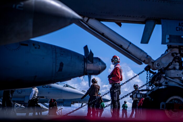 Sailors prepare for flight operations on the flight deck of the aircraft carrier USS Nimitz (CVN 68) in the Philippine Sea, April 23, 2025. Nimitz is underway in the U.S. 7th Fleet area of operations on a scheduled deployment, demonstrating the U.S. Navy's unwavering commitment to a free and open Indo-Pacific. (U.S. Navy photo by Mass Communication Specialist 2nd Class Hannah Kantner)