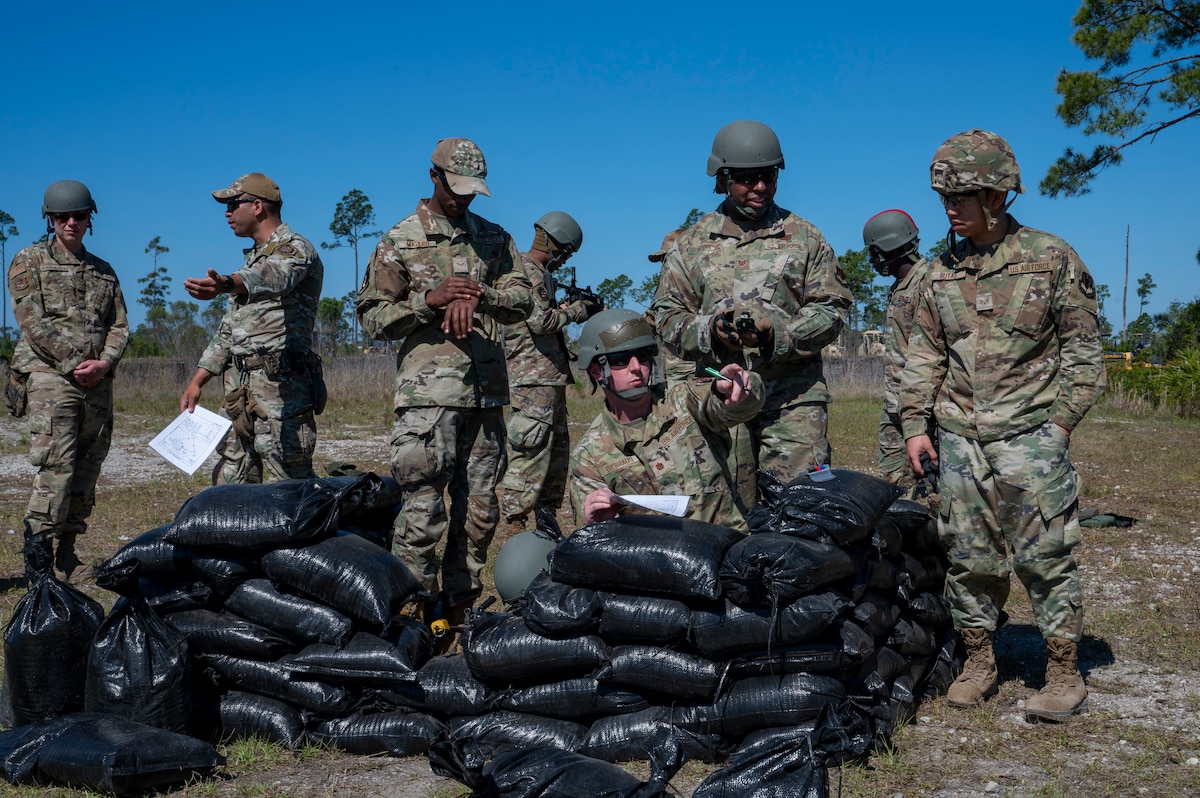 U.S. Air Force Airmen assigned to the 22nd Air Task Force, map out points of interest during exercise MAGPIE at Tyndall Air Force Base, Florida, April 13, 2025. Exercises like MAGPIE will continue to propel the 22nd ATF to operate effectively under stressful conditions in contested environments, resulting in a diverse force of Airmen prepared to undertake mission requirements. (U.S. photo by Airman 1st Class Samantha Thorn)