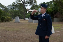 An Air Commando plays taps at the 45th anniversary ceremony of Operation Eagle Claw at Hurlburt Field, Florida, April 24, 2025.