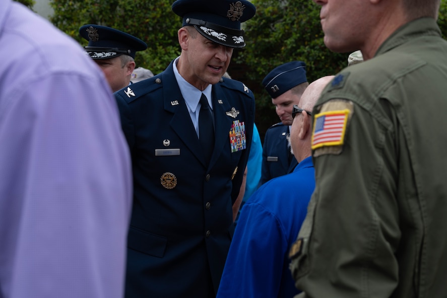 U.S. Air Force Col. Patrick Dierig, 1st Special Operations Wing commander, speaks with a veteran who participated in Operation Eagle Claw following a ceremony commemorating the 45th anniversary at Hurlburt Field, Florida, April 24, 2025.