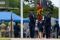 A U.S. Air Force Honor Guardsmen carries a wreath during a ceremony for the 45th anniversary of Operation Eagle Claw at Hurlburt Field, Florida., April 24, 2025.