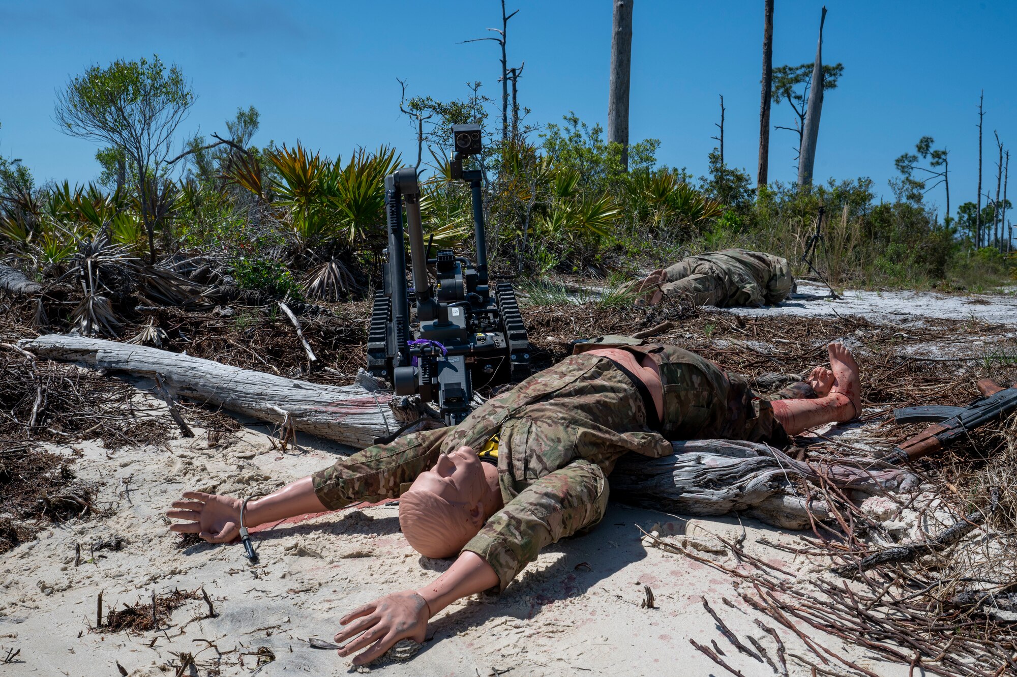 The Man Transportable Robot System Increment II advances towards a simulated hazard during a Silver Flag exercise at Tyndall Air Force Base, Florida, April 9, 2025. The MTRS II is a remotely operated, medium-sized robotic system that enables Explosive Ordnance Disposal units to detect, confirm, identify and dispose of unexploded explosive ordnance and other hazards from a safe distance. Exercises like this will continue to propel the 22nd ATF to operate effectively under stressful conditions in contested environments, resulting in a diverse force of Airmen prepared to undertake mission requirements. (U.S. photo by Airman 1st Class Samantha Thorn)