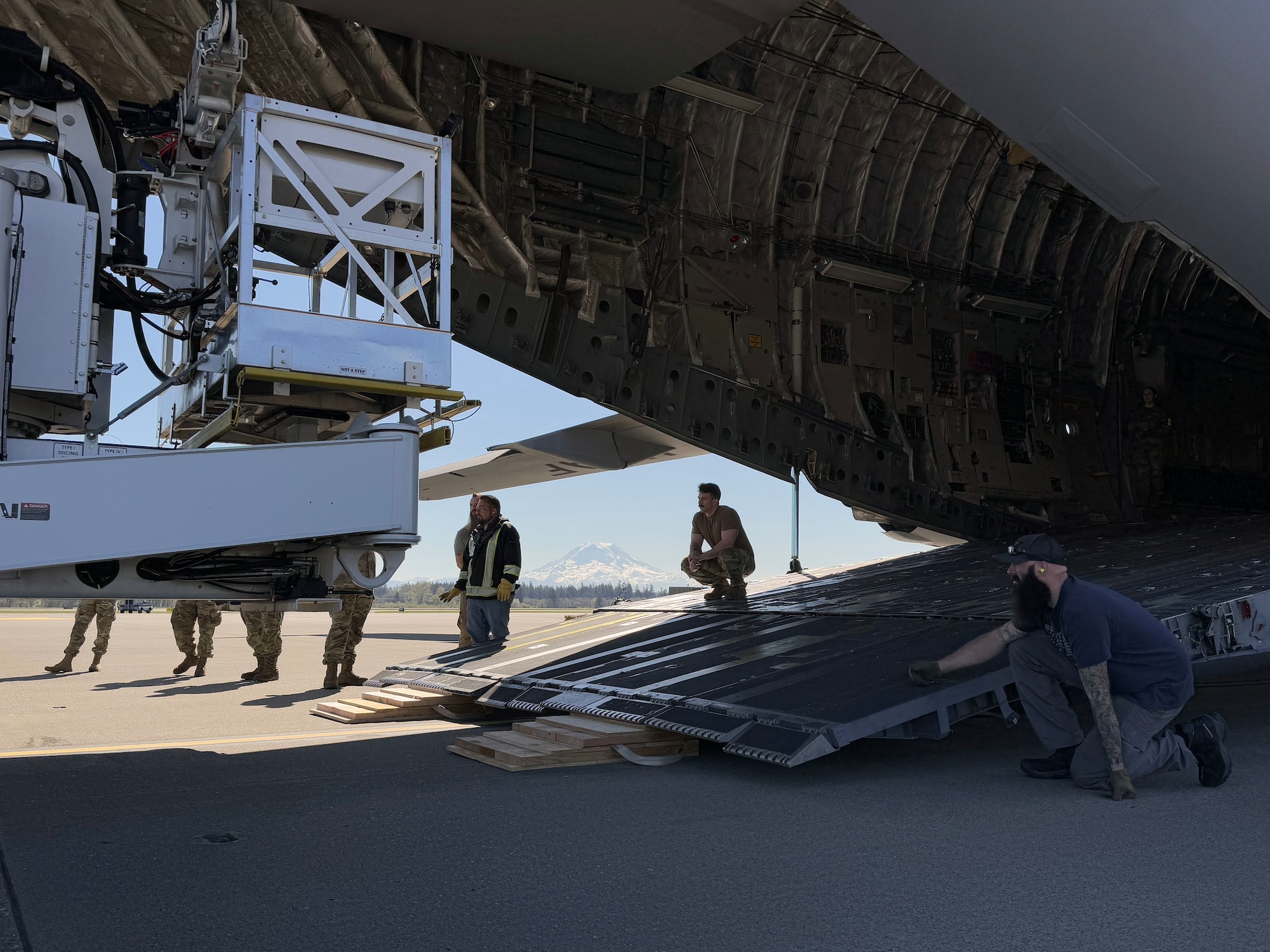 Team McChord Airmen and civilians across 62d Aerial Port Squadron, 62d Maintenance Group and the 4th Airlift Squadron loaded an Altec high-reach crane onto a C-17 Globemaster III at Joint Base Lewis-McChord, Washington, April 17, 2025. The crane was transported to Arizona to facilitate the replacement of the pitch trim actuator in the tail of another 62d Airlift Wing C-17. This crucial transport ensures Team McChord Airmen and aircraft are returned to a mission-capable status to support today’s global airlift mission.