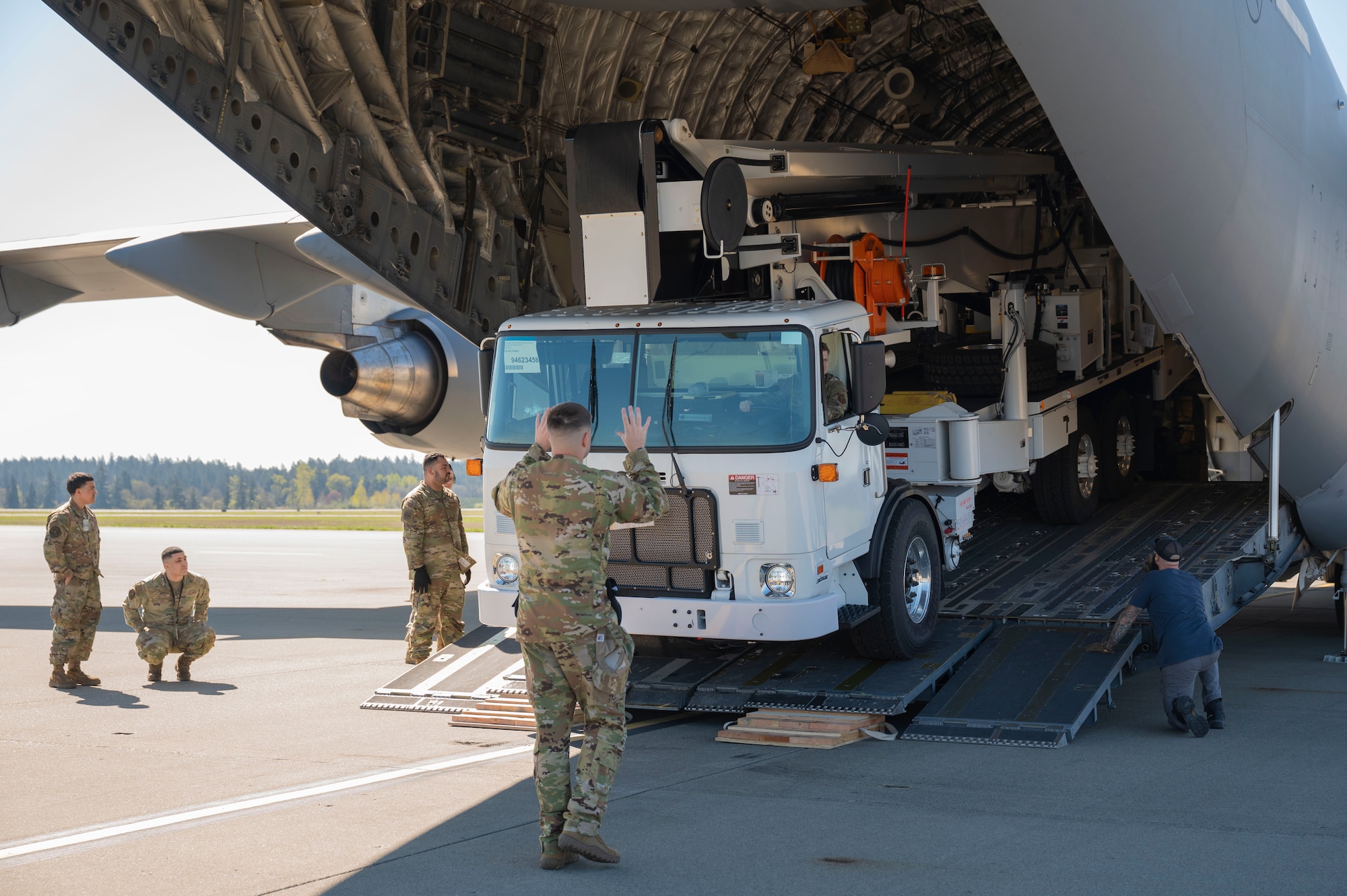 Team McChord Airmen and civilians across 62d Aerial Port Squadron, 62d Maintenance Group and the 4th Airlift Squadron loaded an Altec high-reach crane onto a C-17 Globemaster III at Joint Base Lewis-McChord, Washington, April 17, 2025. The crane was transported to Arizona to facilitate the replacement of the pitch trim actuator in the tail of another 62d Airlift Wing C-17. This crucial transport ensures Team McChord Airmen and aircraft are returned to a mission-capable status to support today’s global airlift mission.