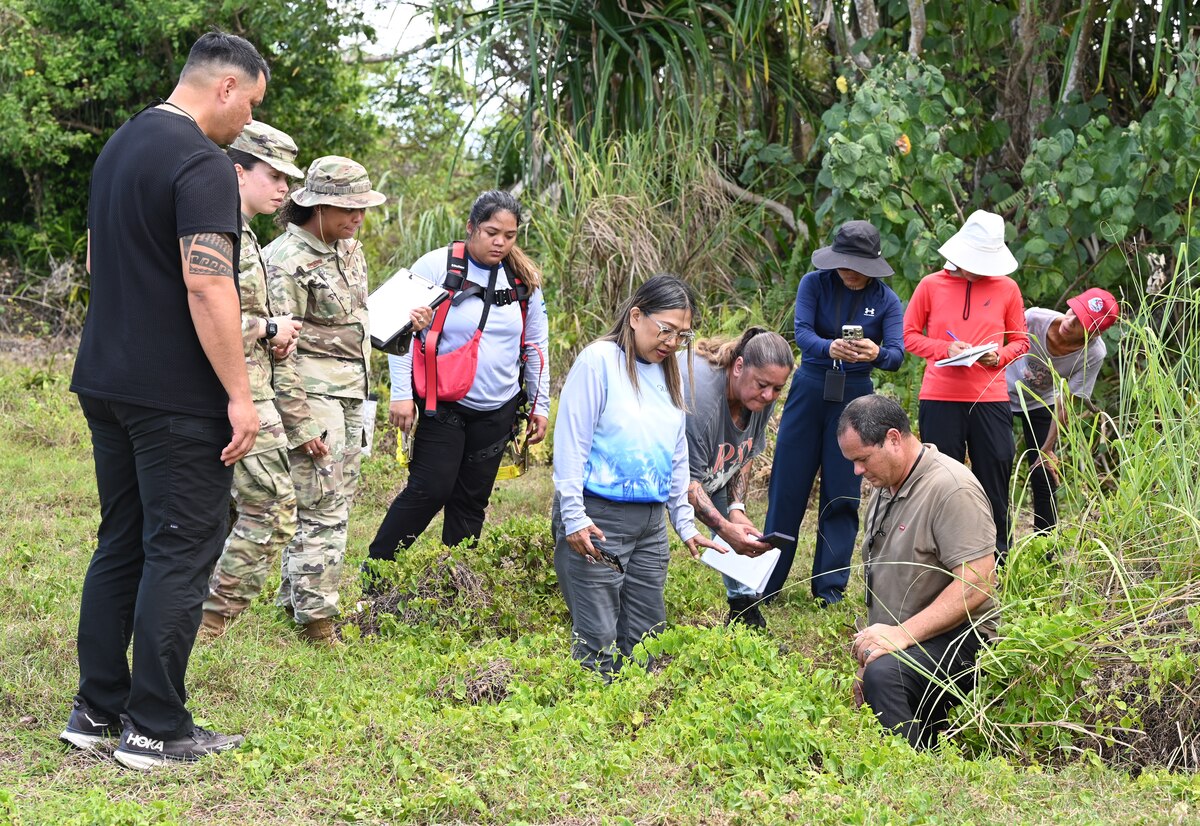 U.S. Air Force Bioenvironmental Engineering, 36th Medical Group, and 36th Civil Environmental Squadron, inspect water drainage with Guam Environmental Protection Agency (EPA), Water and Fuels Systems Maintenance and Infrastructure, during a sanitation survey inspection at Northwest Field, Andersen Air Force Base, Guam, April 23, 2025. Routinely monitoring water levels will reduce the likelihood of unseen contaminants that could cause various health effects like gastrointestinal illnesses or chronic diseases like cancer and/or more. (U.S. Air Force photo by Airman 1st Class Adasha Williams)