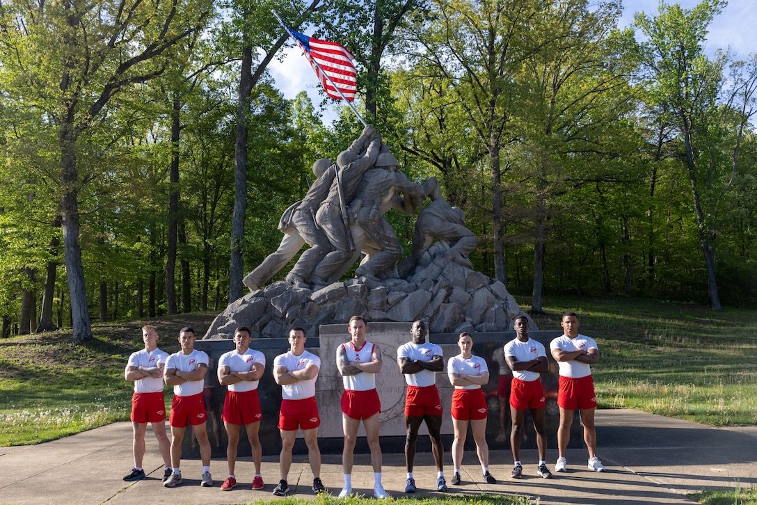 U.S. Marine Corps physical training instructors with Officer Candidates School pose for a group photo in front of the Iwo Jima statue on Marine Corps Base Quantico, April 23, 2025. Physical training instructors at OCS prepare officer candidates for the physical demands of the Marine Corps by training, screening and evaluating their physical aptitude. OCS candidates, upon graduating, can choose to commission into the Marine Corps to lead future generations of Marines. (U.S. Marine Corps photo by Lance Cpl. Jeffery Stevens)