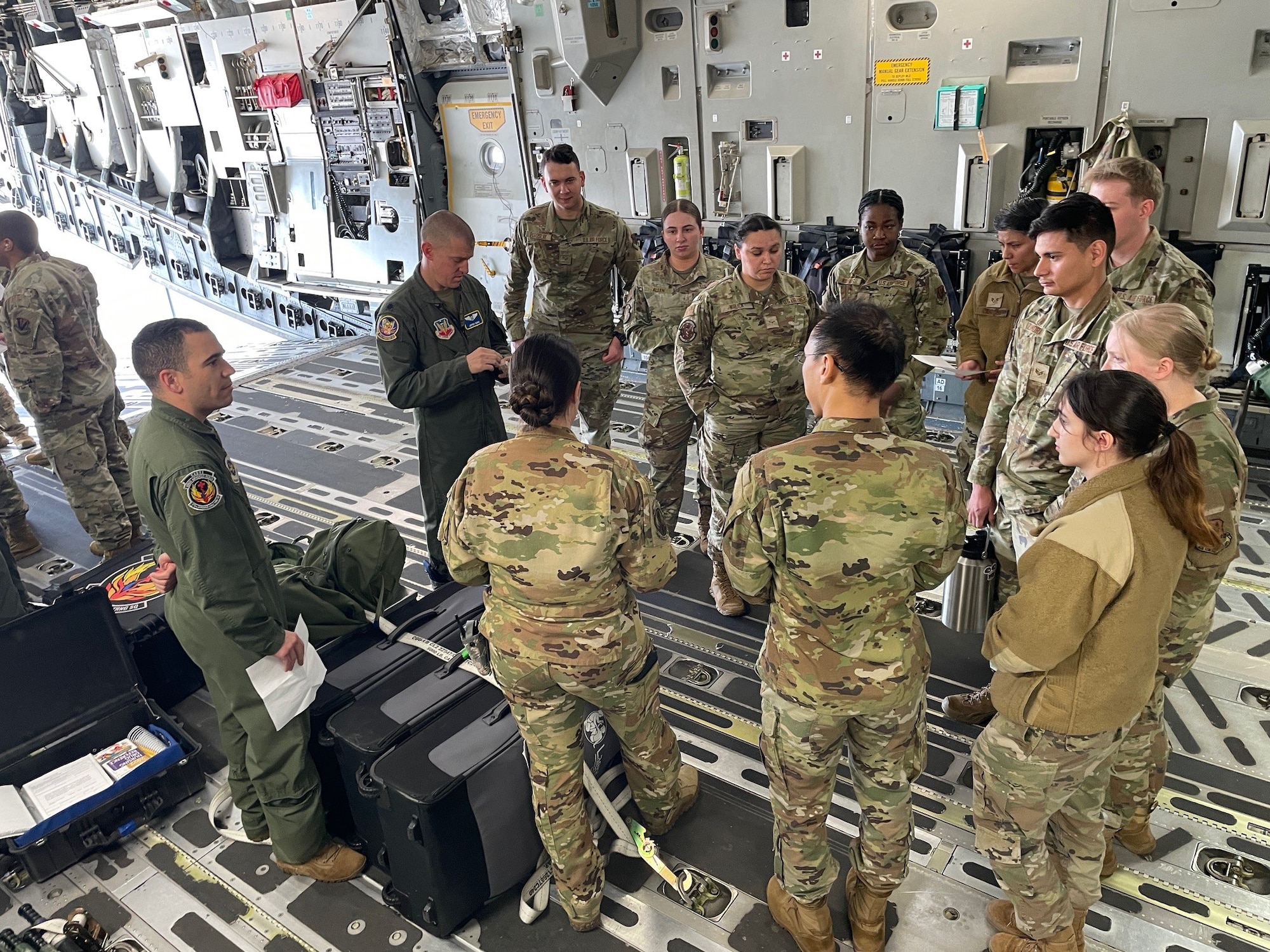 U.S. Air Force 375th Aeromedical Evacuation Training Squadron Airmen, stationed at Wright Patterson Air Force Base, Ohio, conduct training for 20th Medical Group Airmen at Shaw AFB, S.C., March 13, 2025. The 20th MDG Airmen received comprehensive briefings from the 375th AETS crew members, ranging from the initial call for AE capabilities and the paperwork involved, to the baggage requirements for patients and actual on-board care. (U.S. Air Force courtesy photo)