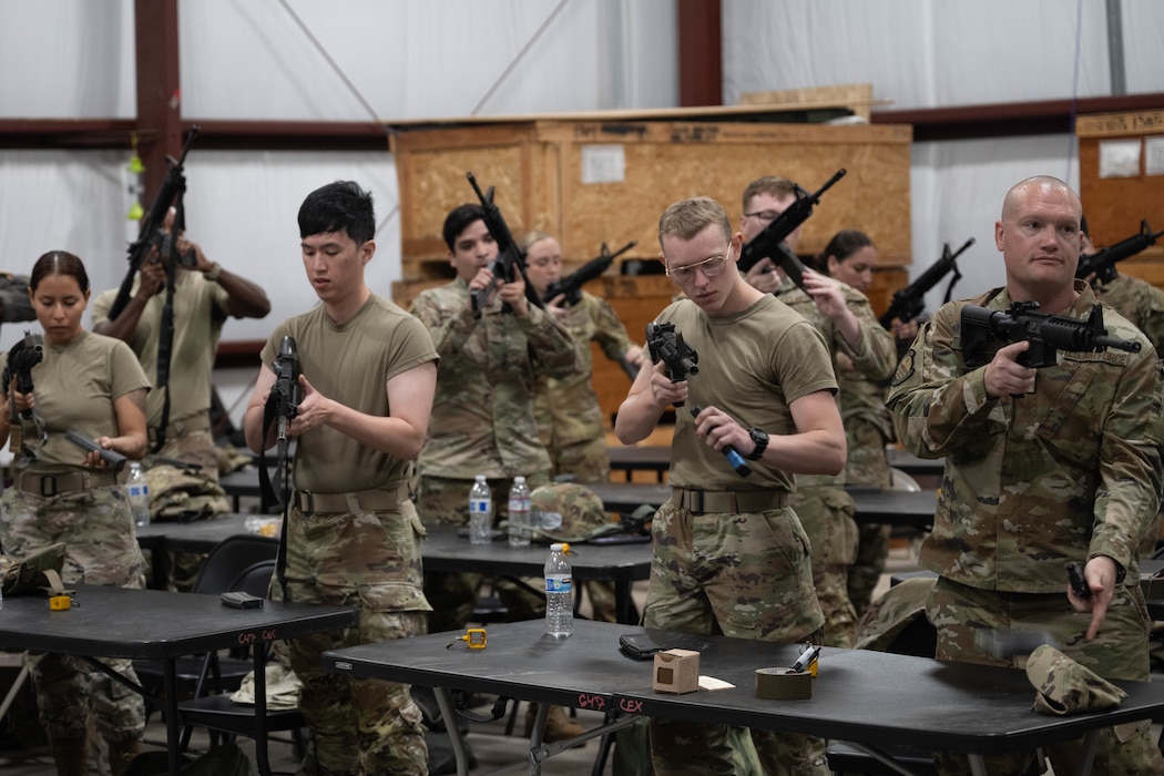 Airmen handling weapons