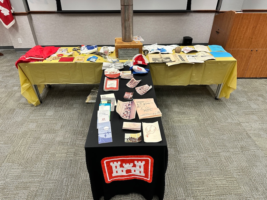 Buried in April 1990, the district's time capsule was opened as part of the 75th anniversary festivities. Some of the items within the capsule were various brochures, patches, buttons, and emergency operations materials.  There were also photographs of the office of counsel, the Lavon Lake staff, Lavon Lake flood gates, district engineers, the executive staff, and the engineering staff (Military Branch)