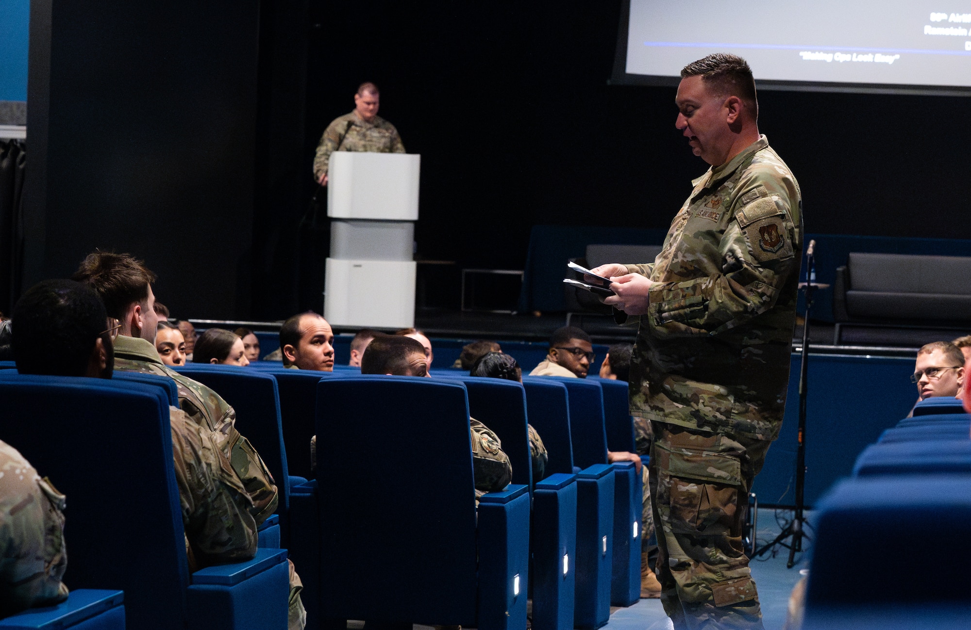 man speaks to an audience