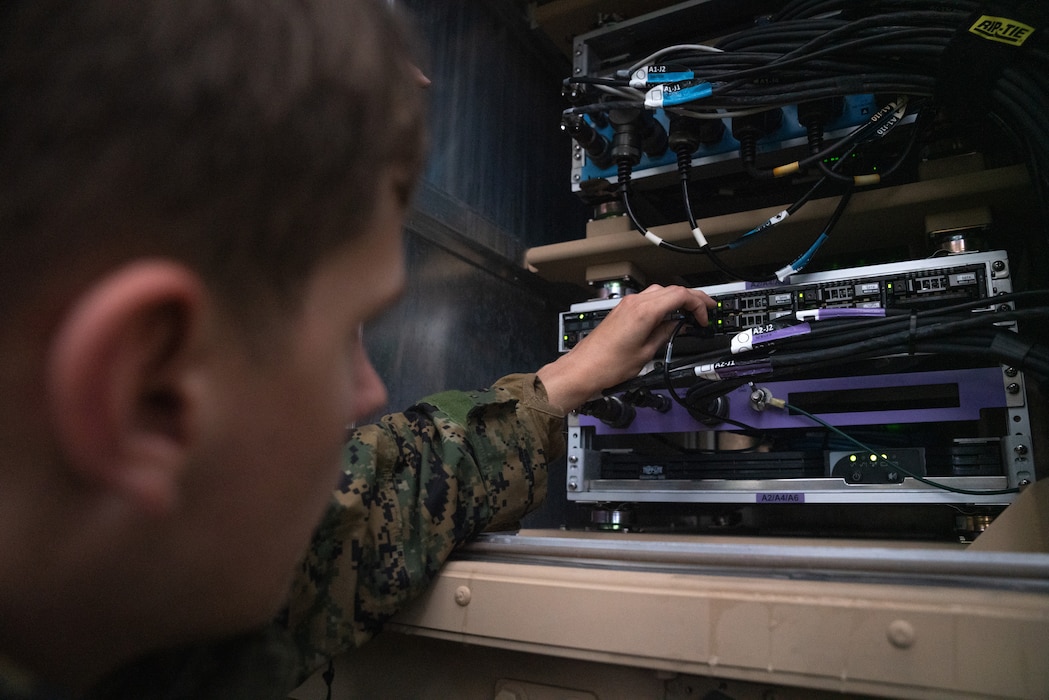 U.S. Marines with Marine Tactical Air Command Squadron (MTACS) 48, 4th Marine Aircraft Wing, maintain communication and network capabilties during Northern Lightning 23 at Volk Field Air National Guard Base, Wisconsin, Aug. 14, 2023. Northern Lightning is one of the seven Air National Guard joint accredited readiness exercises that increases military readiness by providing participating units a tactical, joint training environment to execute realistic combat training. (U.S. Marine Corps photo by Cpl. Ujian Gosun)