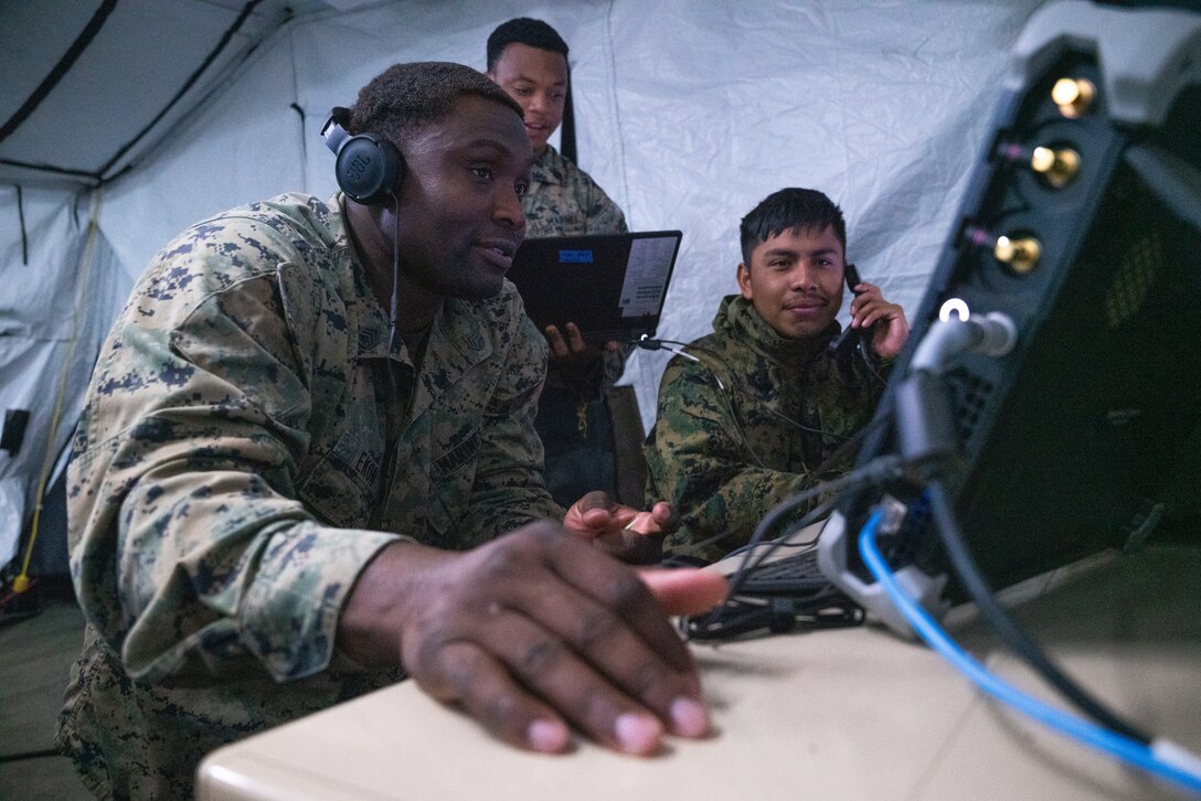 U.S. Marines with Marine Air Control Squadron (MACS) 24, 4th Marine Aircraft Wing, conduct various simulated mission scenarios during Northern Lightning 23 at Volk Field Air National Guard Base, Wisconsin, Aug. 14, 2023. Northern Lightning is one of the seven Air National Guard joint accredited readiness exercises that increases military readiness by providing participating units a tactical, joint training environment to execute realistic combat training. (U.S. Marine Corps photo by Cpl. Ujian Gosun)