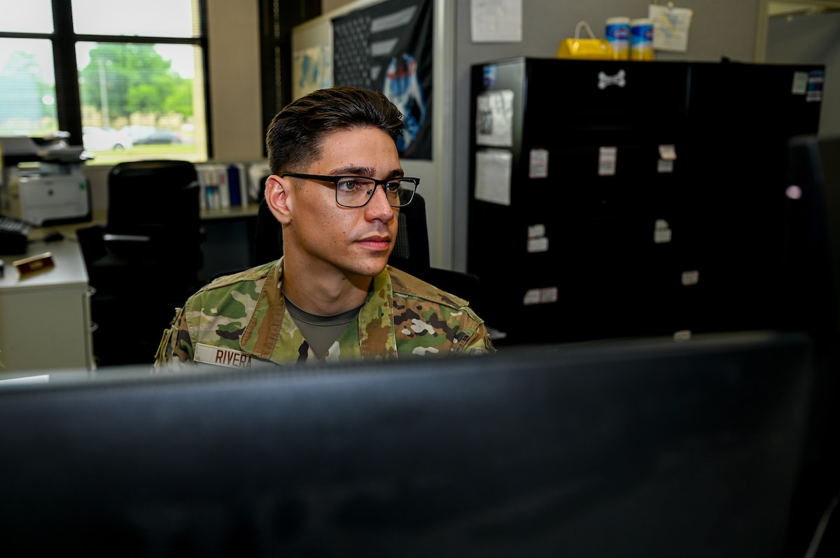 U.S. Air Force Senior Airman Joseph Rivera, 42nd Logistics Readiness Squadron passenger travel technician, works on a computer at his desk at Maxwell Air Force Base, Alabama, April 24, 2025.