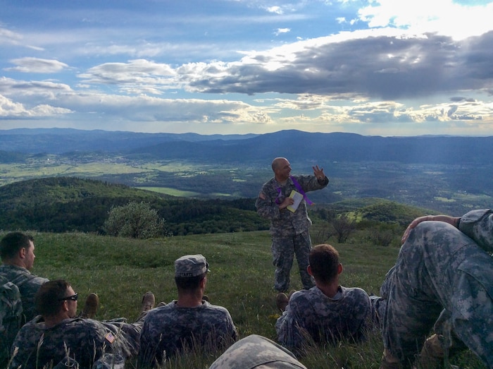 While on routine maneuvers, Rev. Richard Barfield conducts fellowship for deployed U.S. Army service members in Slovenia.