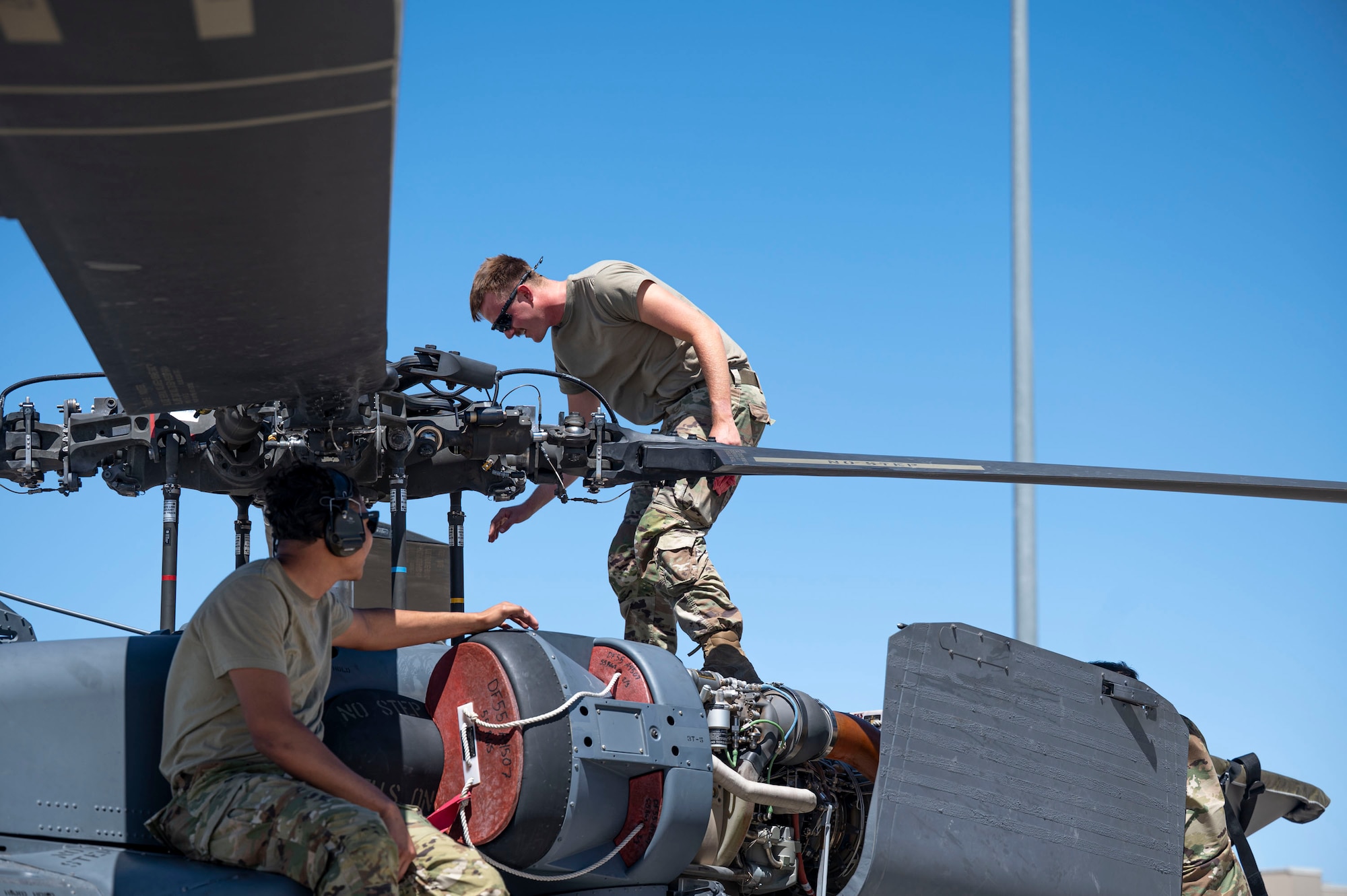 U.S. Air Force Airmen assigned to the 55th Rescue Generation Squadron conduct maintenance checks on the HH-60W Jolly Green II helicopter to maintain mission readiness at Davis-Monthan Air Force Base, Arizona, April 23, 2025. The 55th RGS generates and sustains safe, rescue-ready airpower to save lives and critical assets anywhere, anytime. (U.S. Air Force photo by Airman Samantha Melecio)