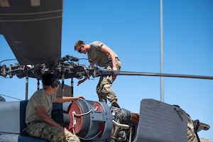 U.S. Air Force Airmen assigned to the 55th Rescue Generation Squadron conduct maintenance checks on the HH-60W Jolly Green II helicopter to maintain mission readiness at Davis-Monthan Air Force Base, Arizona, April 23, 2025. The 55th RGS generates and sustains safe, rescue-ready airpower to save lives and critical assets anywhere, anytime. (U.S. Air Force photo by Airman Samantha Melecio)