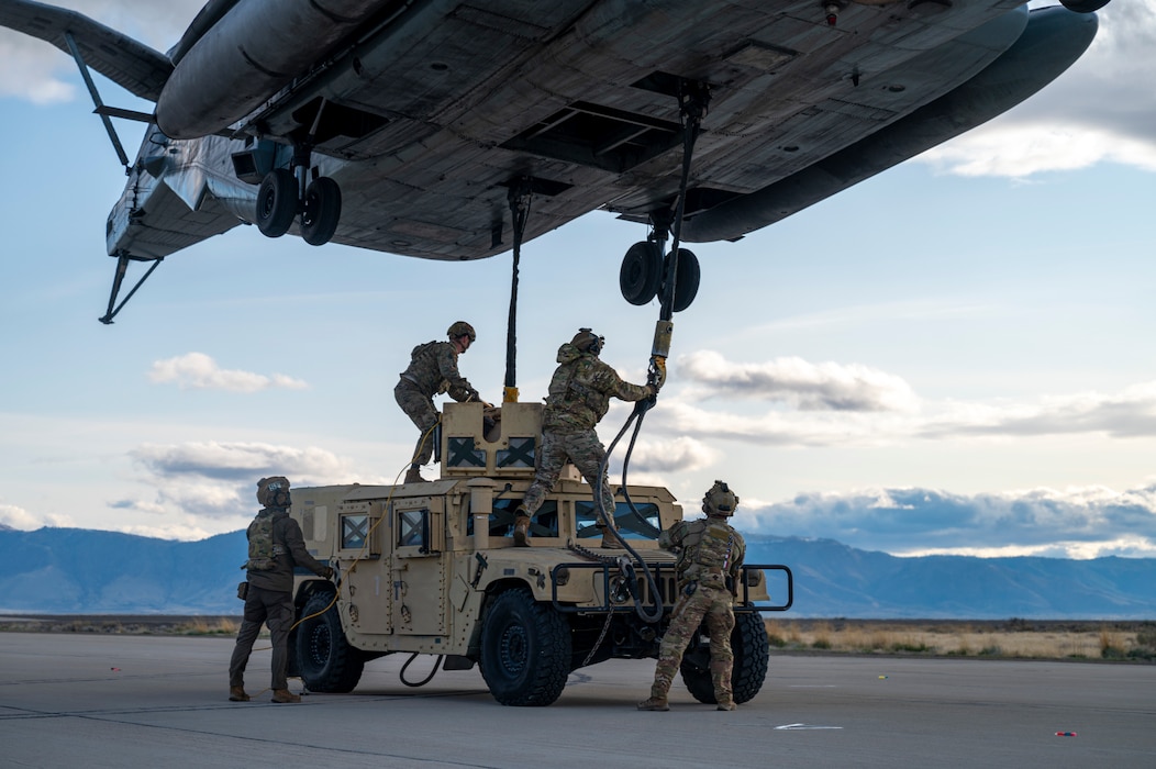 Airman perform sling load