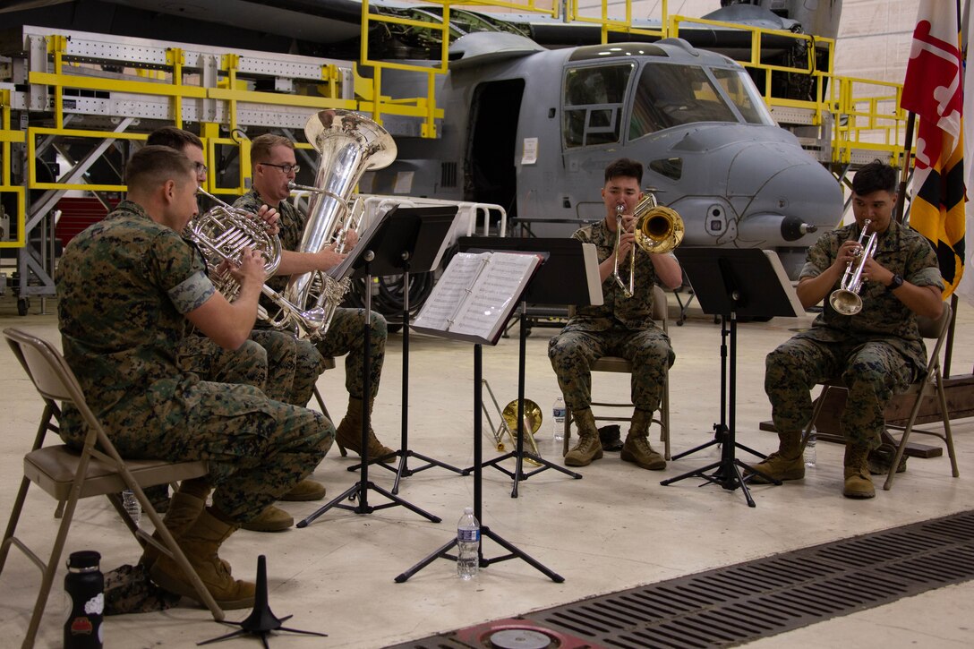 U.S. Marines with Marine Wing Headquarters Squadron 2, 2nd Marine Air Wing Band perform during the Marine Aviation Logistics Squadron 49 change of command ceremony on Marine Corps Air Station New River, in Jacksonville, North Carolina, April 12, 2025. The change of command ceremony represents the transfer of responsibility, authority, and accountability from the outgoing commanding officer to the incoming commanding officer. (U.S. Marine Corps photo   by Lance Cpl. Hunter T. Brock)
