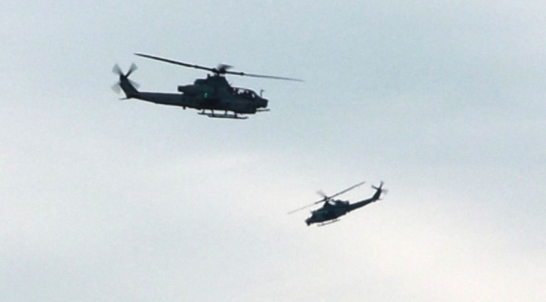 Cobra AHT-1Z and Huey UH-1Y gunships circle their targets in preparation for day/night aerial gunnery missions on range 59C at Fort Dix. The squadron is based at Joint Base McGuire–Dix–Lakehurst, NJ and falls under the command of Marine Aircraft Group 49 (MAG-49).  (Images provided by the Fort DIX USASA Training Division / Steven Roussel)