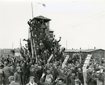 Newly liberated prisoners of the Allach concentration camp celebrate their liberation near Dachau, Germany, April 30, 1945.