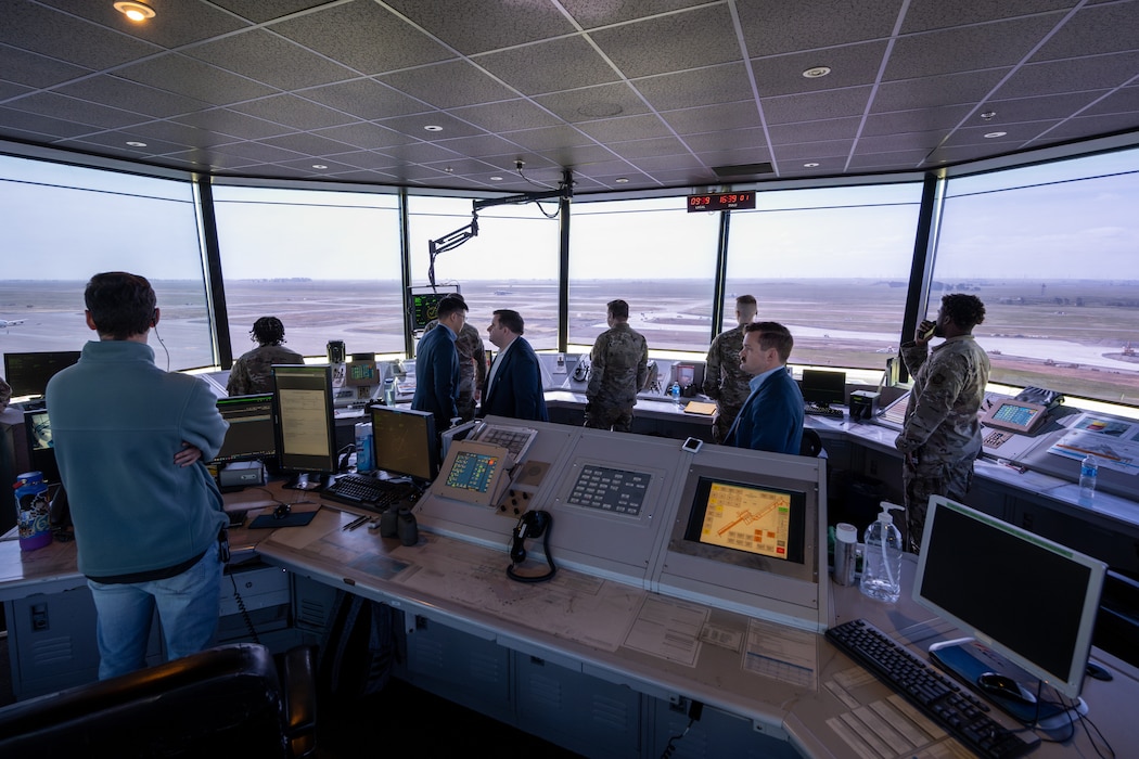Airmen work inside air traffic control tower