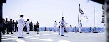 Royal Australian Navy sailors aboard the Hobart-class guided-missile destroyer HMAS Sydney (DDG 42) hold a ceremony commemorating Anzac day, which was attended by Sailors from the Independence-variant littoral combat ship USS Omaha (LCS 12), April 25, 2025.