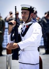Royal Australian Navy sailors aboard the Hobart-class guided-missile destroyer HMAS Sydney (DDG 42) hold a ceremony commemorating Anzac day, which was attended by Sailors from the Independence-variant littoral combat ship USS Omaha (LCS 12), April 25, 2025.