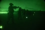 U.S Marines aim at a target in a night shoot during a Combat Marksmanship Coaches Course at Camp Hansen, Okinawa, Japan, April 23, 2025.