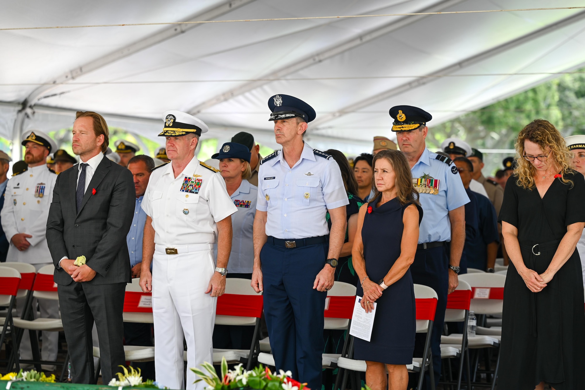 Adm. Sam Paparo, commander of U.S. Indo-Pacific Command; Gen. Kevin B. Schneider, Pacific Air Forces commander; and his wife, Lori, stand during the Australian and New Zealand Army Corps Day ceremony at the National Memorial Cemetery of the Pacific, Honolulu, Hawaii, April 25, 2025. Each year on ANZAC Day, Australians and New Zealanders mark the anniversary of the Gallipoli landings of April 25, 1915, during World War I. (U.S. Air Force photo by Senior Airman Melody Bordeaux)